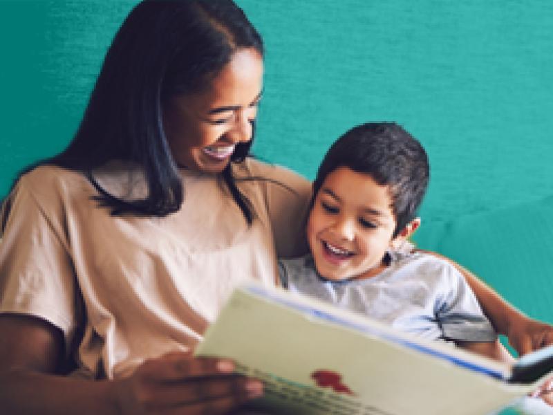 Woman reading to a young boy