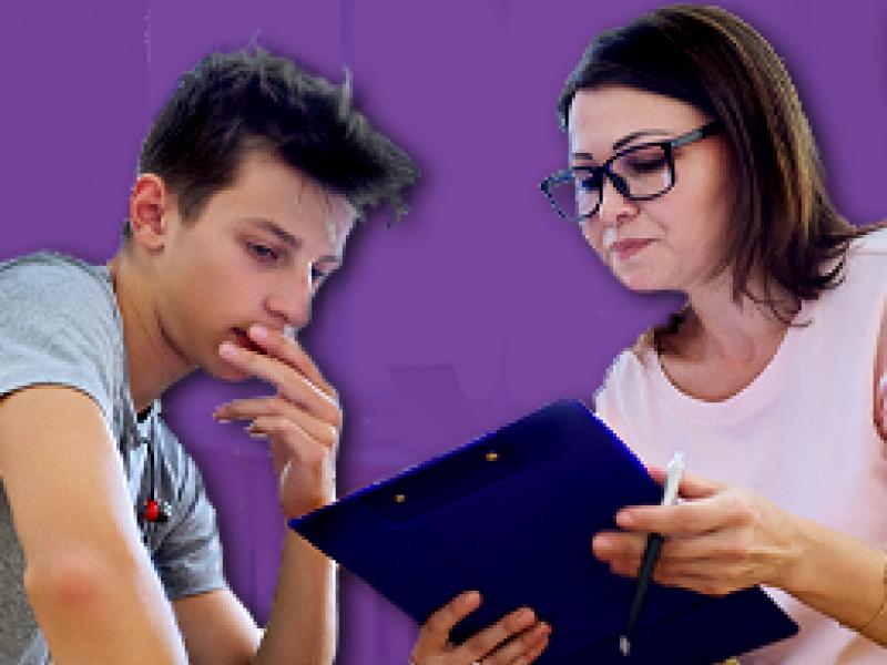 a social worker speaking with a teen