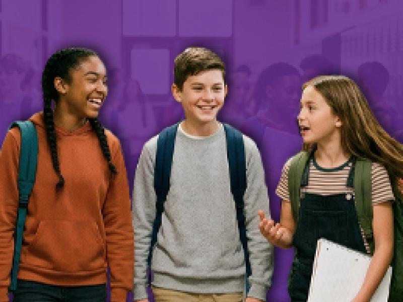 three middle school kids talking to each other