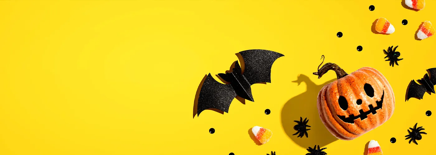 image of a jack-o-lantern, bats and spiders
