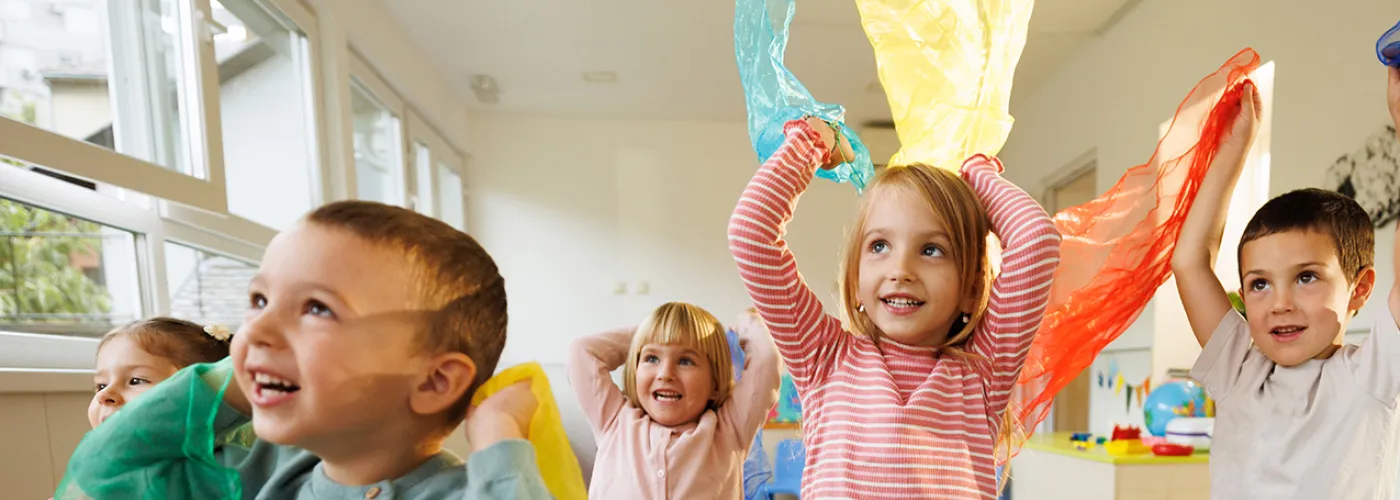 photo of young children dancing