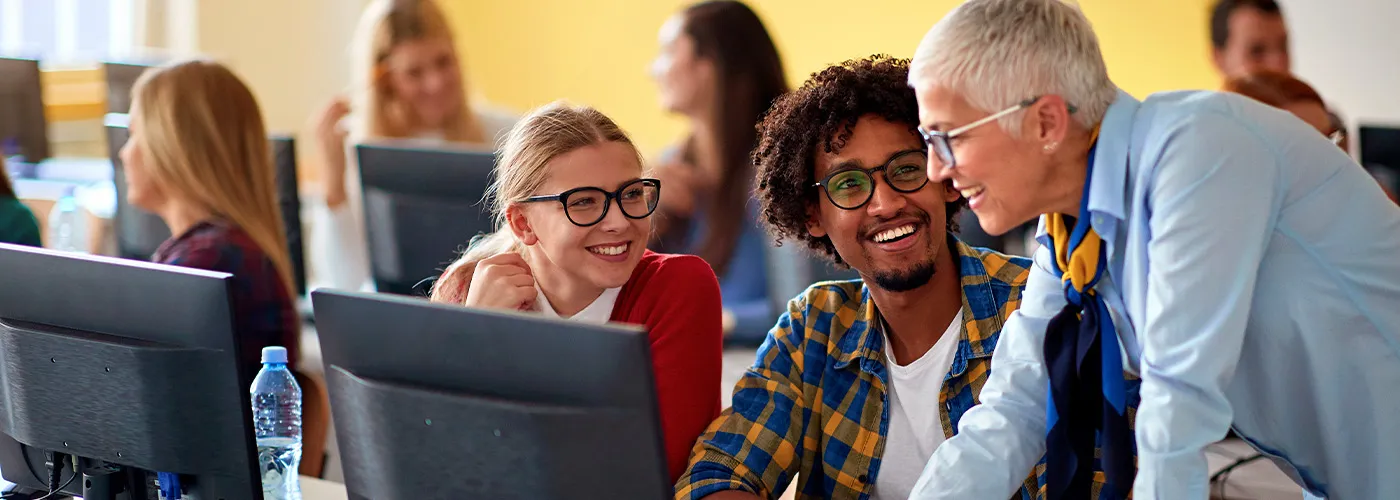 Photo of a teacher teaching a class on digital literacy