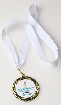 1000 books medal with white ribbon.