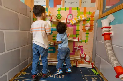 Two children playing a game in storyville